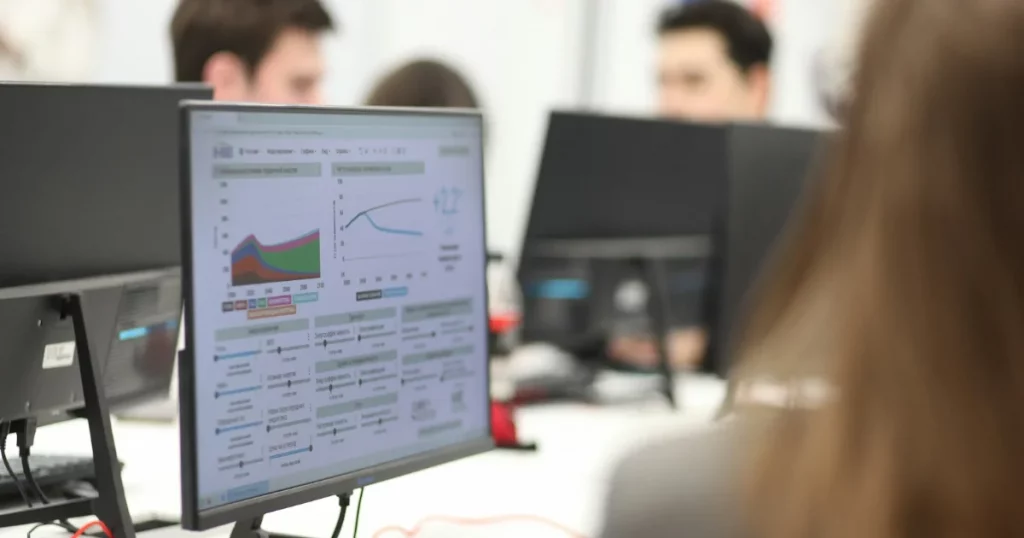 Salesforce AgentExchange: a team reviewing apps and agents on their computers before installing